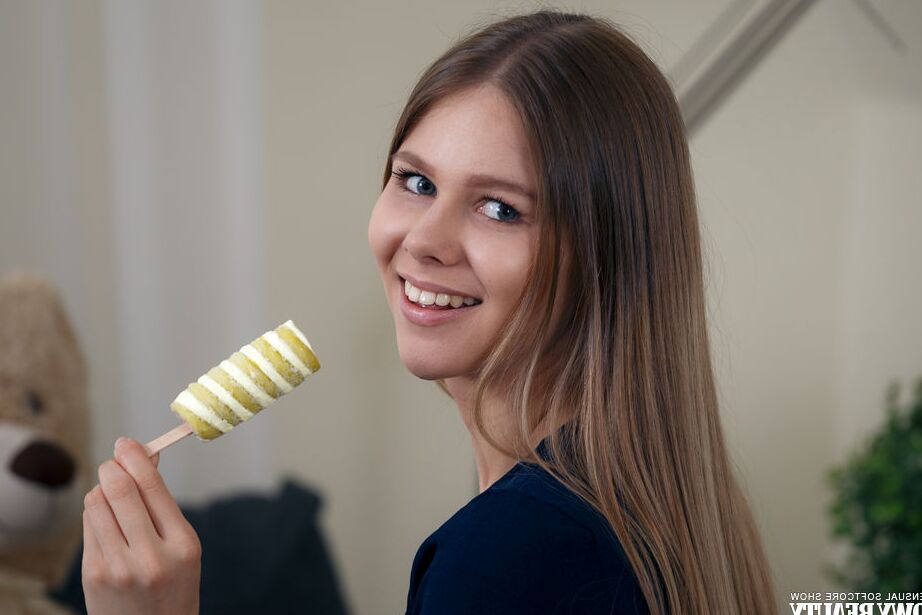 20P Skinny first timer Evelina sucks on a stick of candy while getting naked