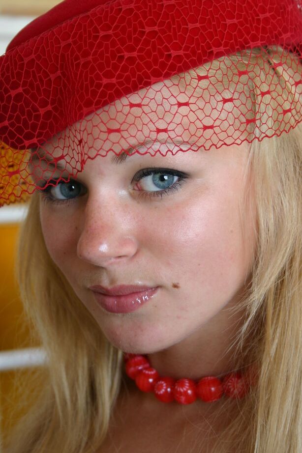 16P Young blonde girl Valya B wears a fancy hat while modeling in the nude