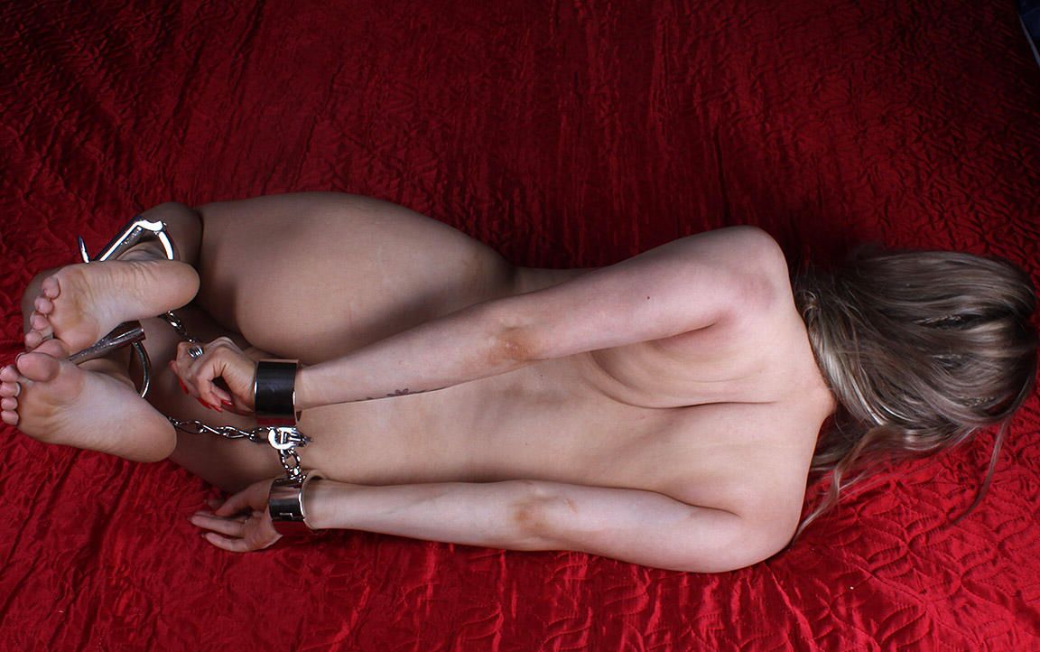 16P Naked white girl Thelma is hogtied with cuffs and left face down by herself