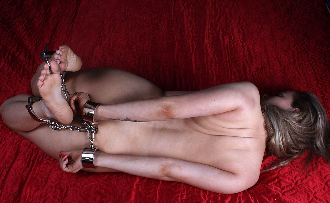 16P Naked white girl Thelma is hogtied with cuffs and left face down by herself