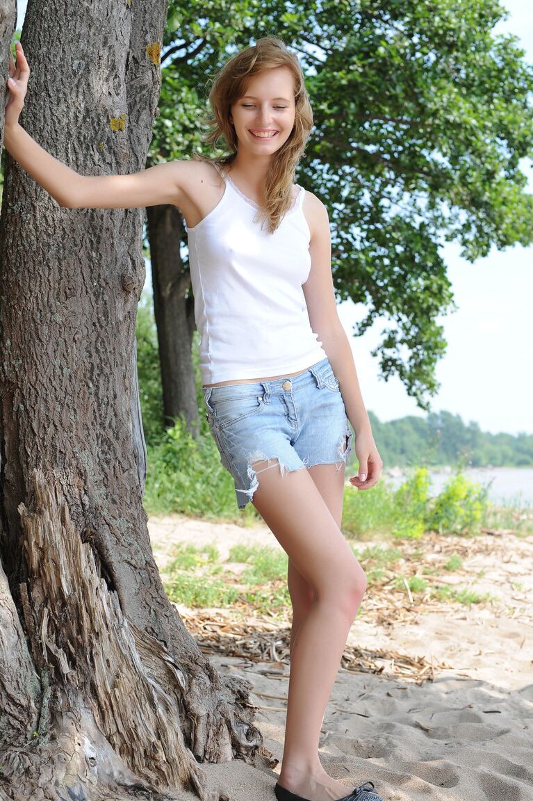 18P Blonde girl Eriska A spreads her bare legs wide open under a beach tree