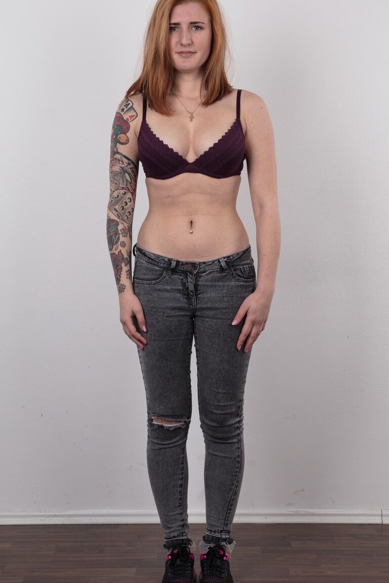 20P Tattooed redhead Nikola stands stiff as board while clothed and buck naked