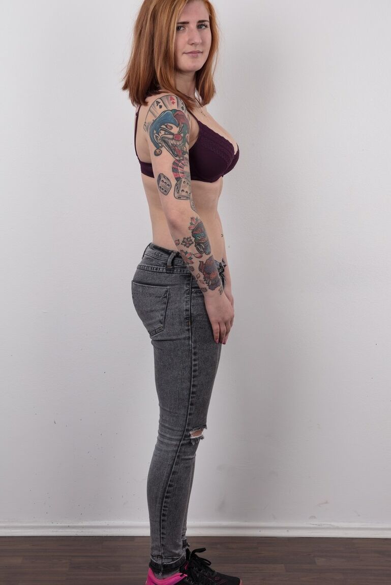 20P Tattooed redhead Nikola stands stiff as board while clothed and buck naked