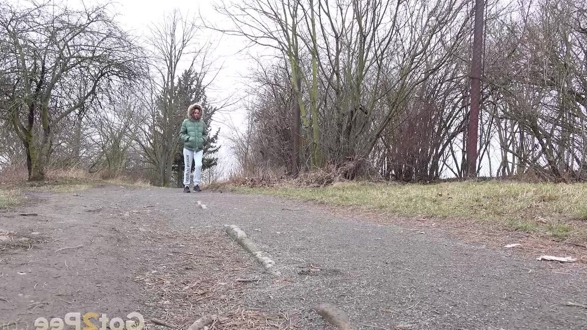 15P Ali B squats on tiptoes to piss by the road