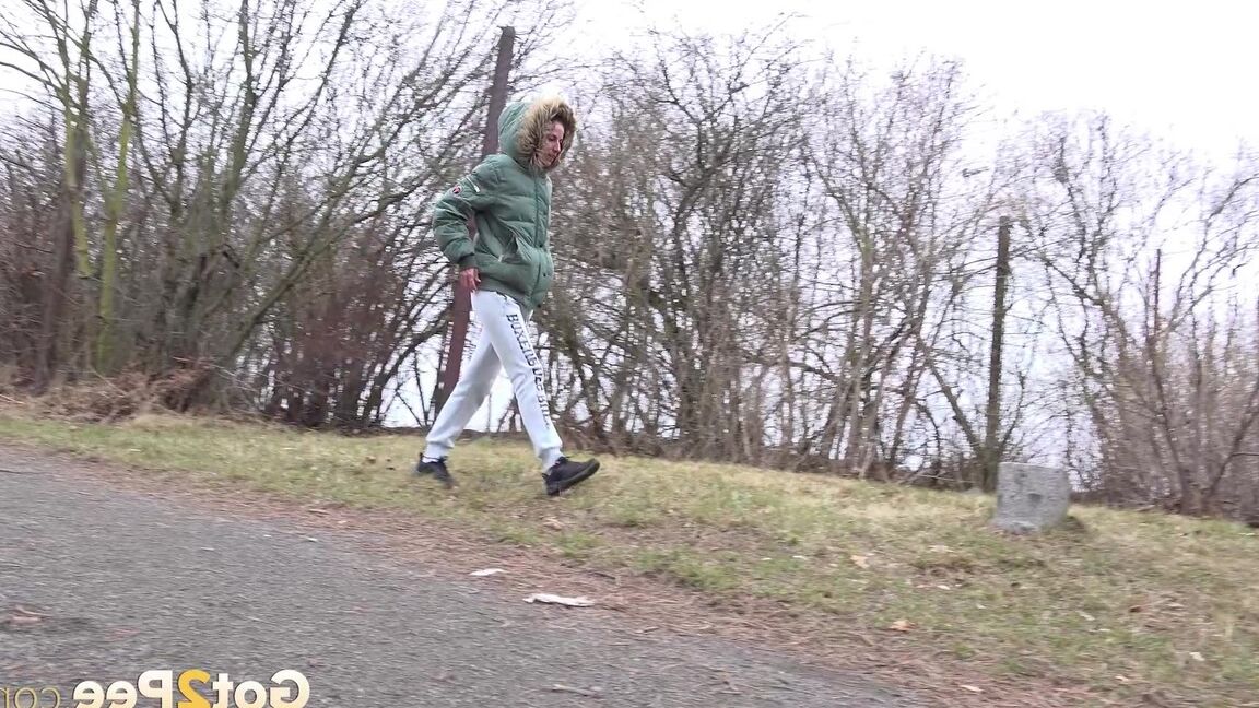 15P Ali B squats on tiptoes to piss by the road