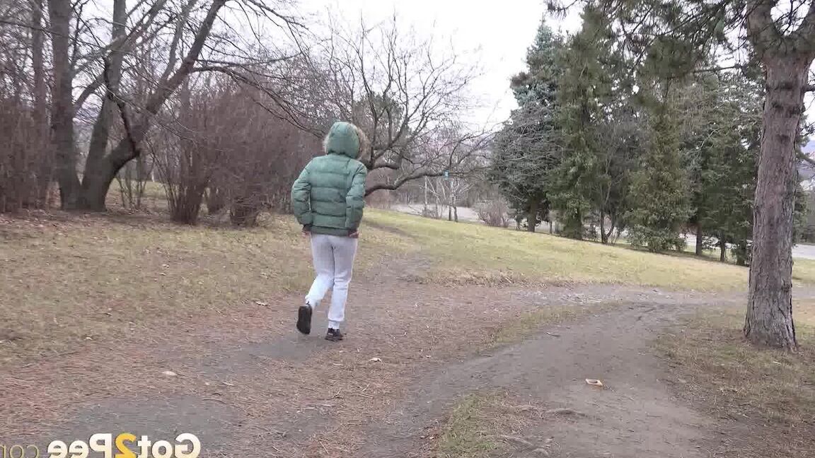 15P Ali B squats on tiptoes to piss by the road