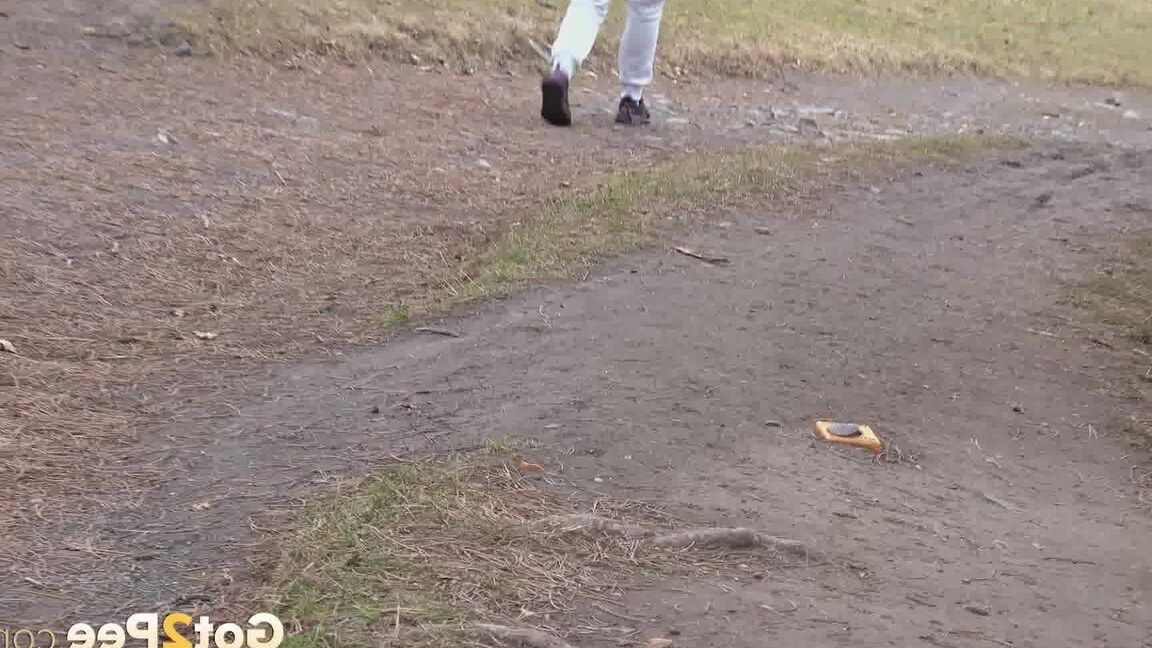 15P Ali B squats on tiptoes to piss by the road