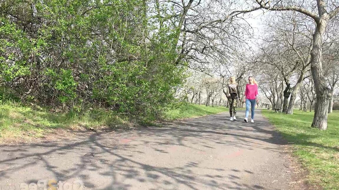 15P Blonde girls Debora & Vanessa Hell squat to pee on a path while out for a walk