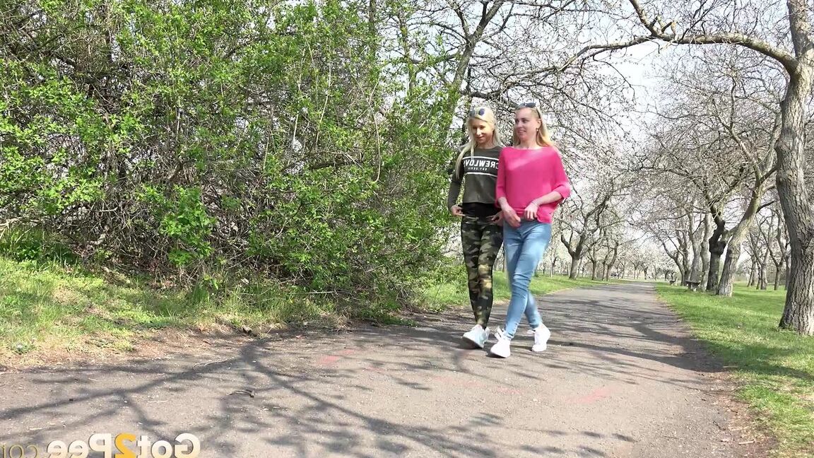 15P Blonde girls Debora & Vanessa Hell squat to pee on a path while out for a walk