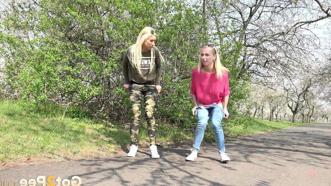 15P Blonde girls Debora & Vanessa Hell squat to pee on a path while out for a walk