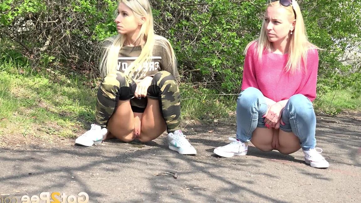15P Blonde girls Debora & Vanessa Hell squat to pee on a path while out for a walk