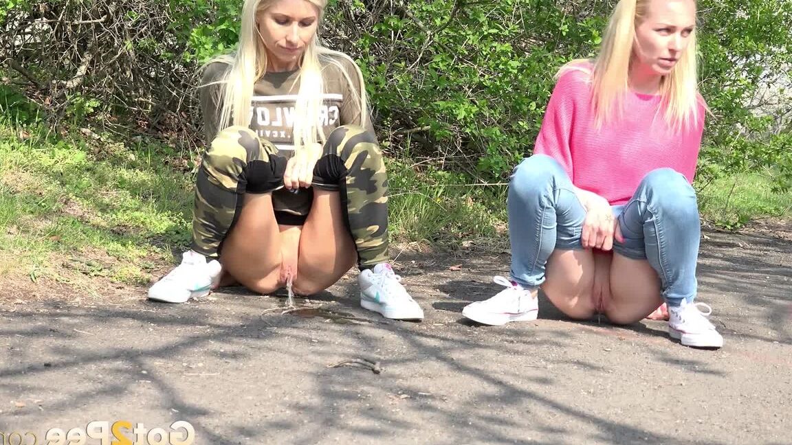 15P Blonde girls Debora & Vanessa Hell squat to pee on a path while out for a walk