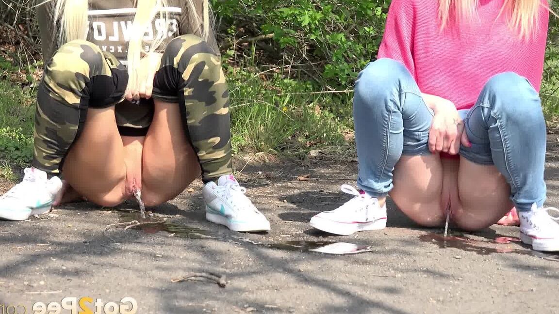 15P Blonde girls Debora & Vanessa Hell squat to pee on a path while out for a walk