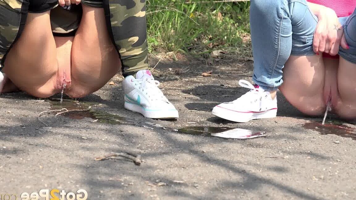 15P Blonde girls Debora & Vanessa Hell squat to pee on a path while out for a walk
