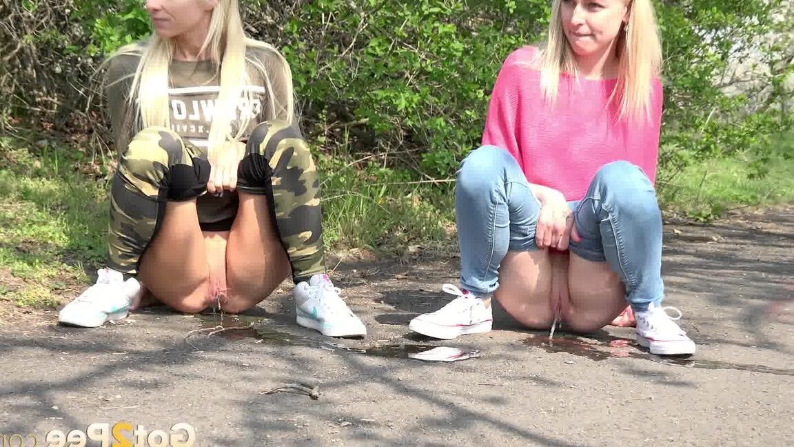 15P Blonde girls Debora & Vanessa Hell squat to pee on a path while out for a walk