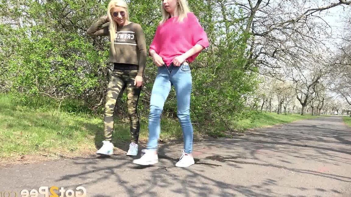 15P Blonde girls Debora & Vanessa Hell squat to pee on a path while out for a walk
