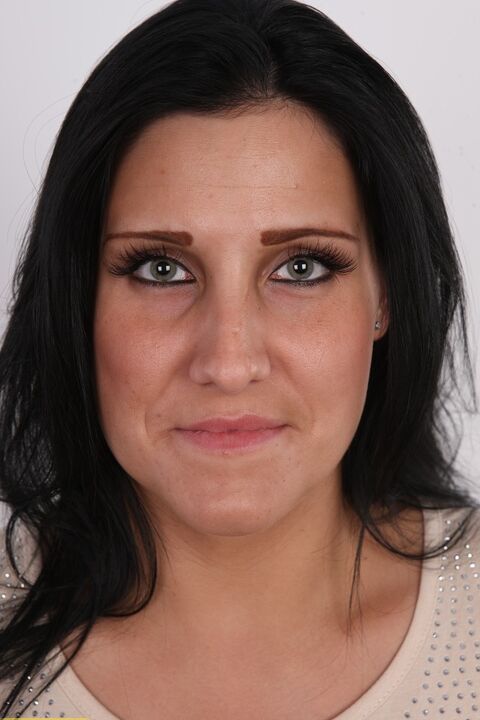 20P Dark-haired girl Iva takes a seat on a stool after getting totally naked