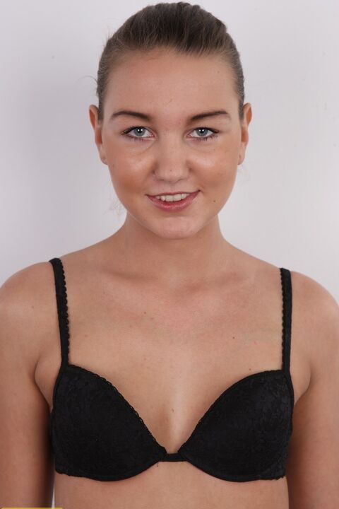 20P Amateur model Jana wears her hair put up while slowly getting stark naked