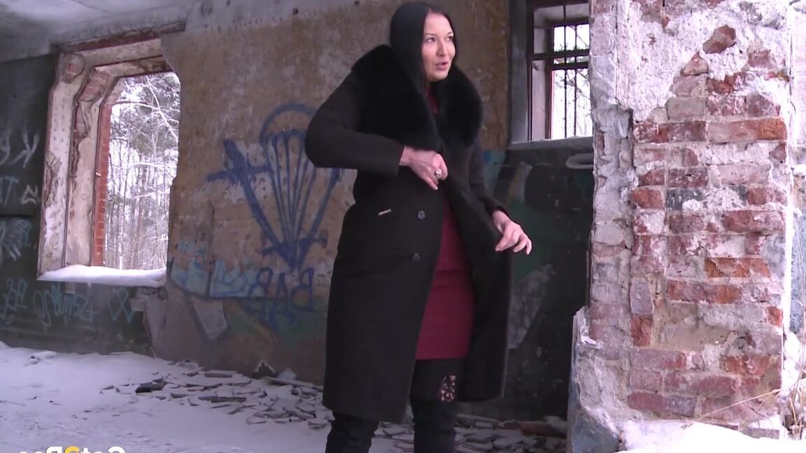 15P Brunette babe pisses in an abandoned building