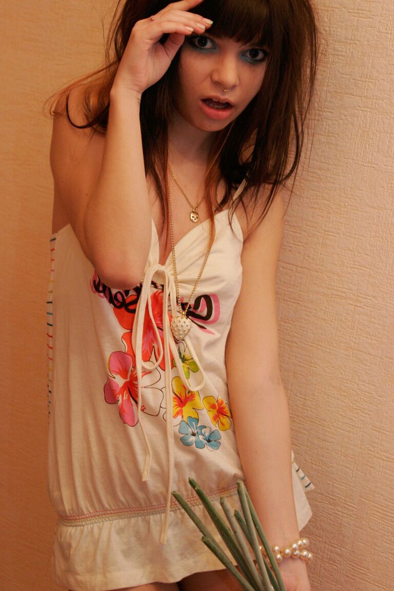 15P Young brunette Kaira 18 sneers while barefoot in a SFW solo shoot