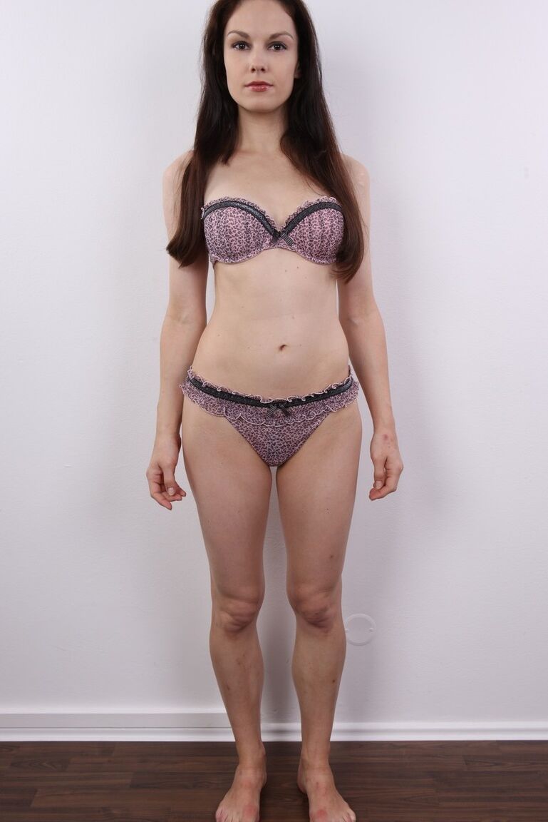 20P Amateur model Eva stands fully clothed before removing all of her clothes