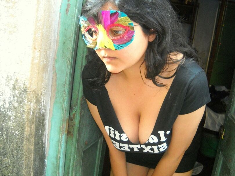 12P Indian amateur Savita Bhabhi wears a mask while playing with her shaved pussy