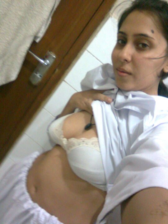 10P Sexy Indian chick uncups saggy tits while getting naked during self shots