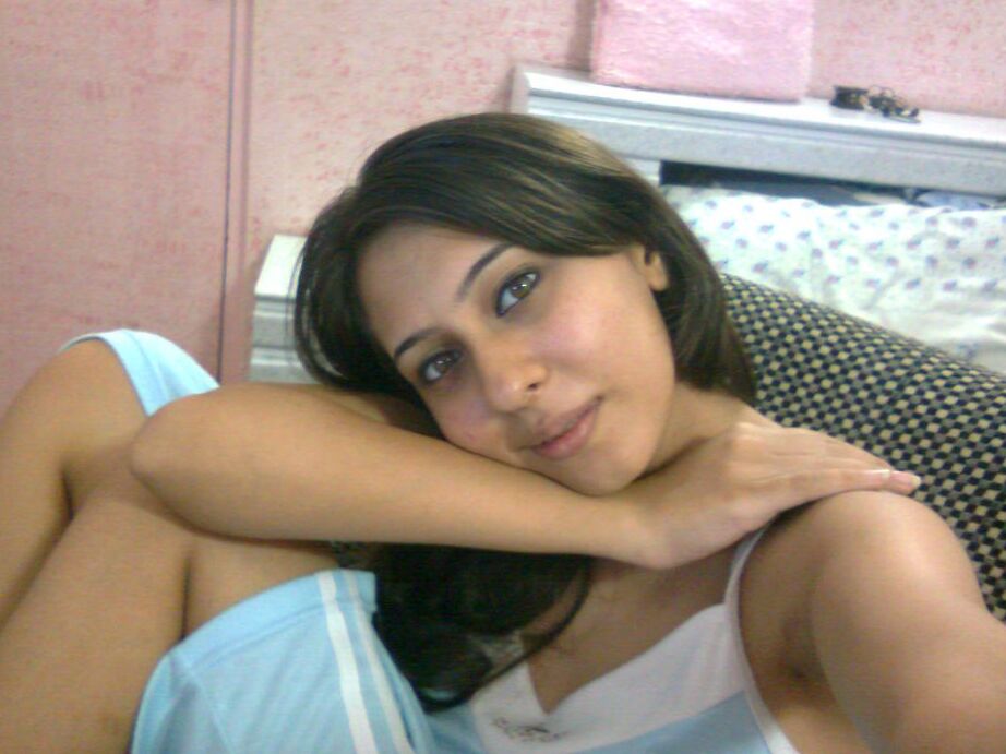 10P Sexy Indian chick uncups saggy tits while getting naked during self shots
