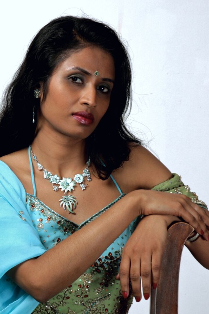 15P Indian woman models in a strapless bra and panties paired with red hosiery