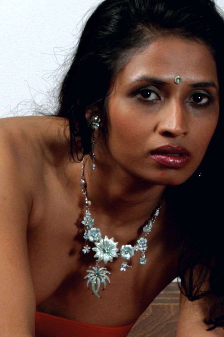 15P Indian woman models in a strapless bra and panties paired with red hosiery