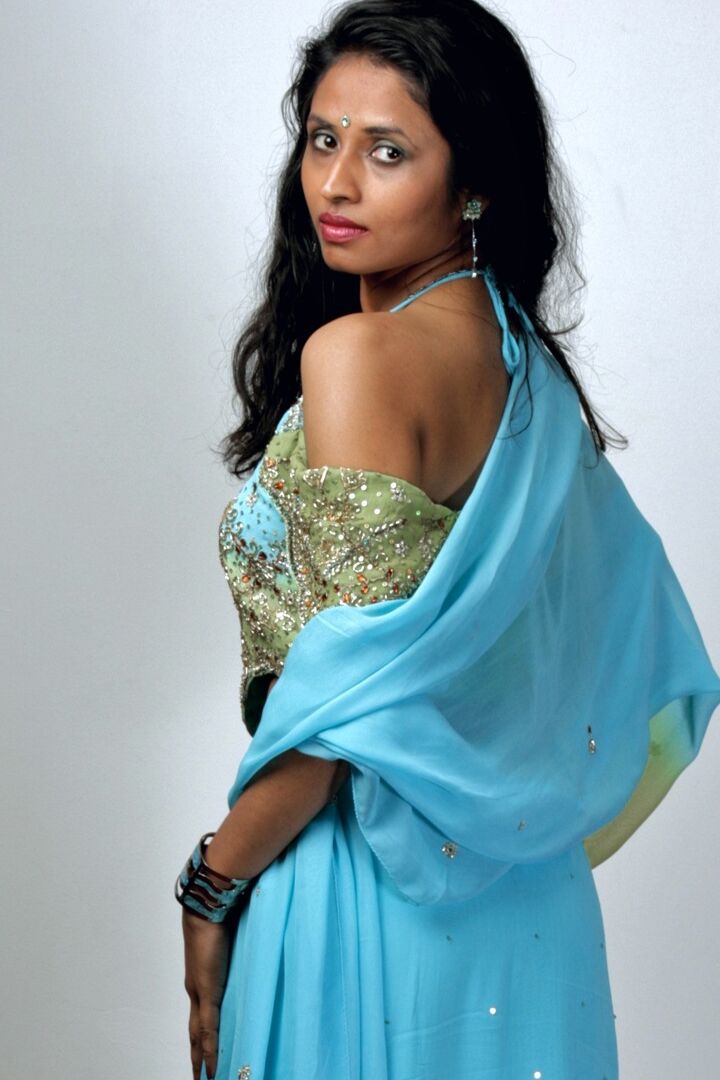 15P Indian woman models in a strapless bra and panties paired with red hosiery