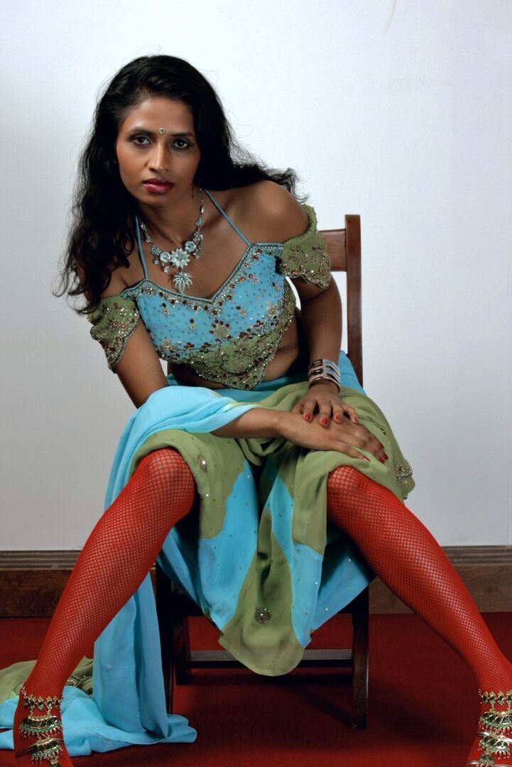 15P Indian woman models in a strapless bra and panties paired with red hosiery
