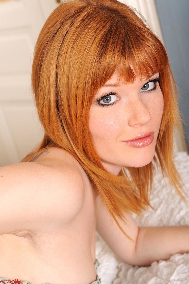 21P Hot ginger Mia Sollis puts her lace socks on her sensitive feet and poses