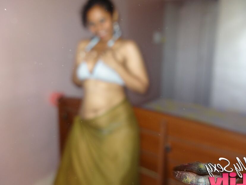 16P Indian woman lets a boob slip loose from her bra while being a tease