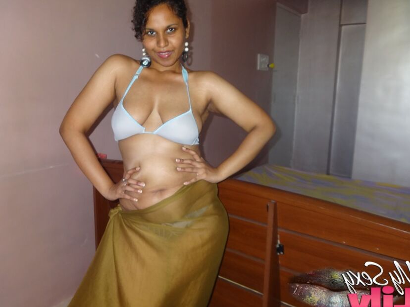 16P Indian woman lets a boob slip loose from her bra while being a tease