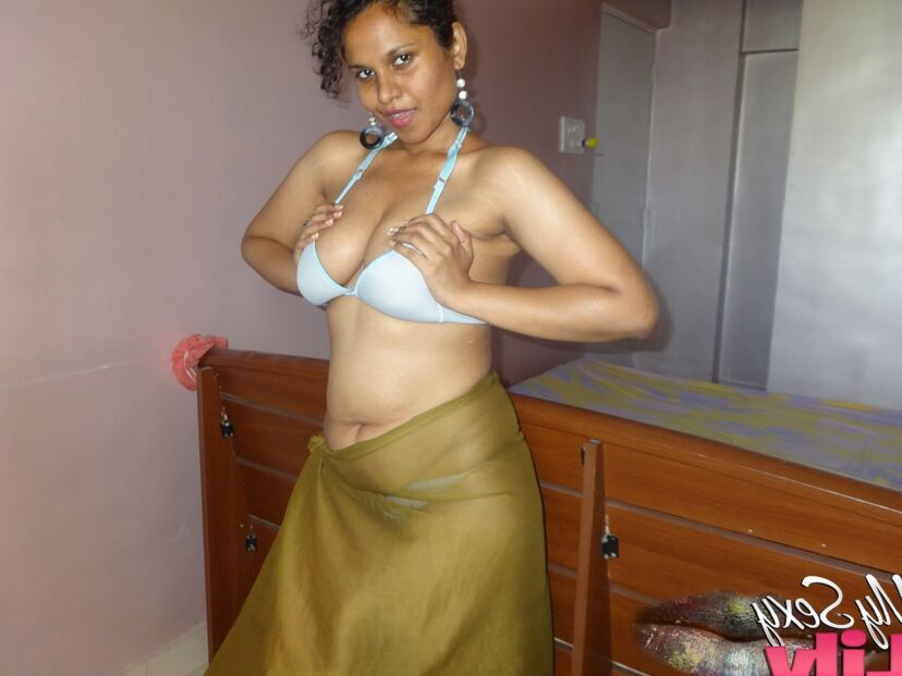 16P Indian woman lets a boob slip loose from her bra while being a tease