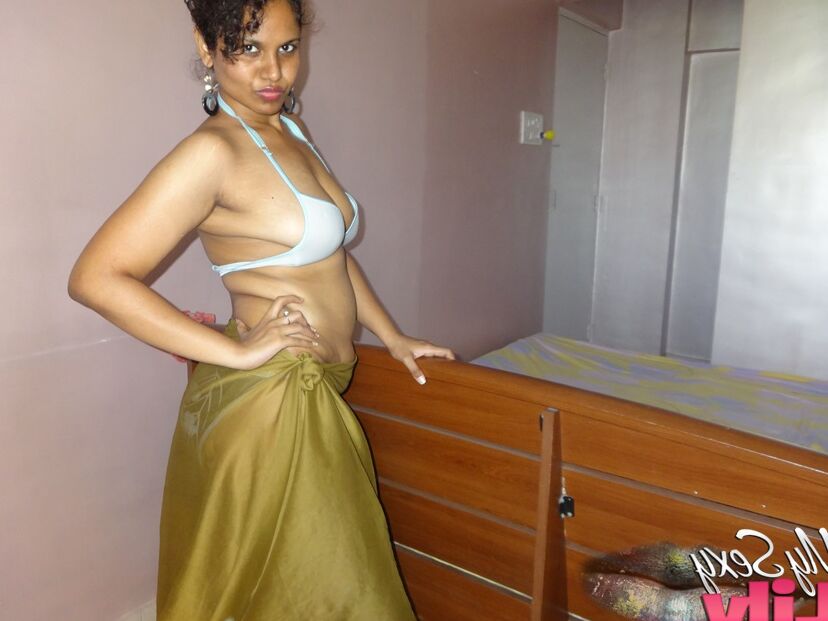 16P Indian woman lets a boob slip loose from her bra while being a tease