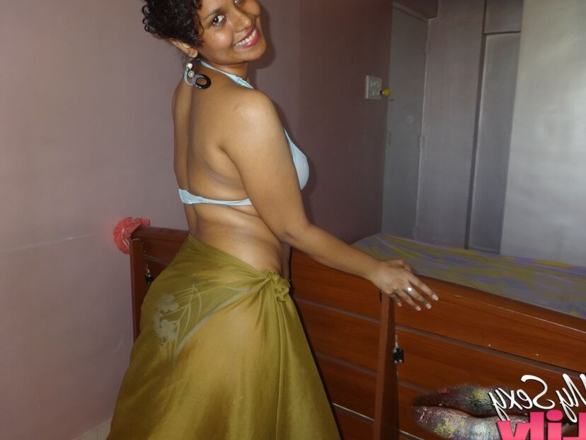 16P Indian woman lets a boob slip loose from her bra while being a tease