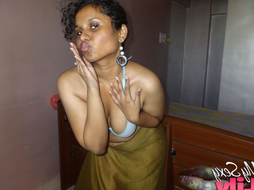 16P Indian woman lets a boob slip loose from her bra while being a tease