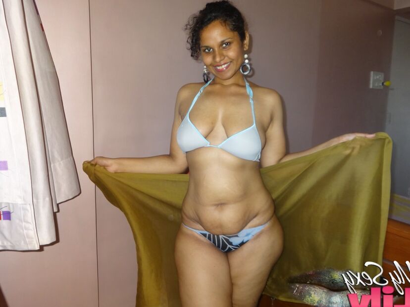 16P Indian woman lets a boob slip loose from her bra while being a tease