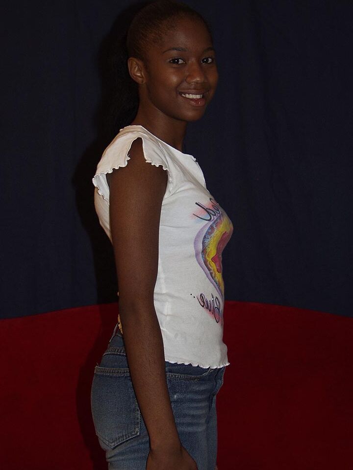 16P Black amateur Monique shows the pink of twat after stripping to white socks