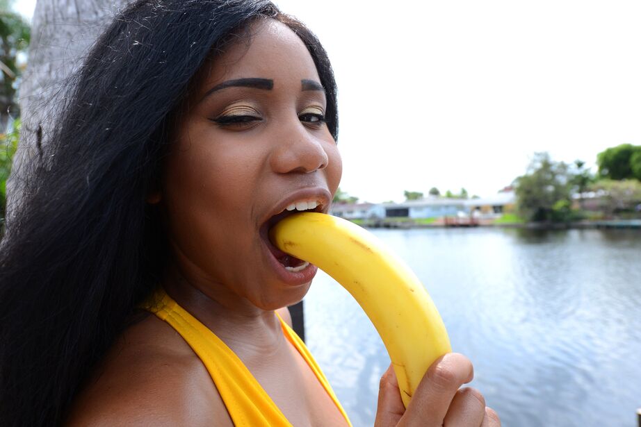 12P Black chicks Tara Fox and Indigo Vanity suck on bananas attired in swimsuits