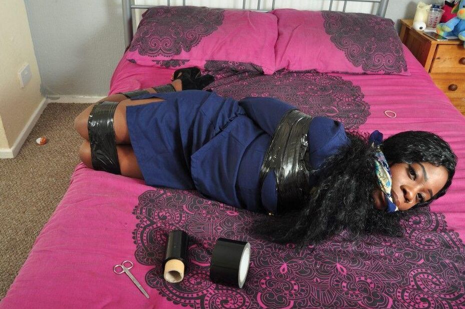16P Black stewardess finds herself cleave gagged and hogtied on a bed