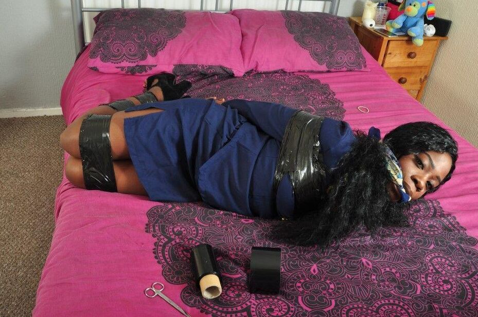 16P Black stewardess finds herself cleave gagged and hogtied on a bed