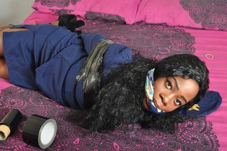 16P Black stewardess finds herself cleave gagged and hogtied on a bed