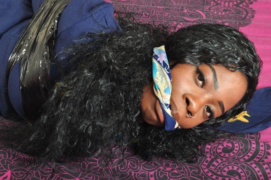 16P Black stewardess finds herself cleave gagged and hogtied on a bed