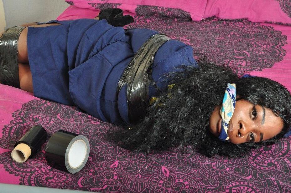 16P Black stewardess finds herself cleave gagged and hogtied on a bed