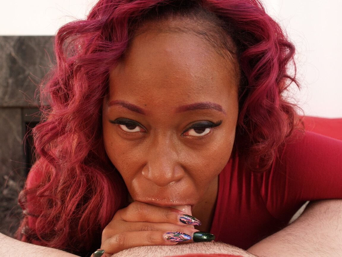 20P Curly haired redheaded ebony gets her face covered with jizz after a blowjob