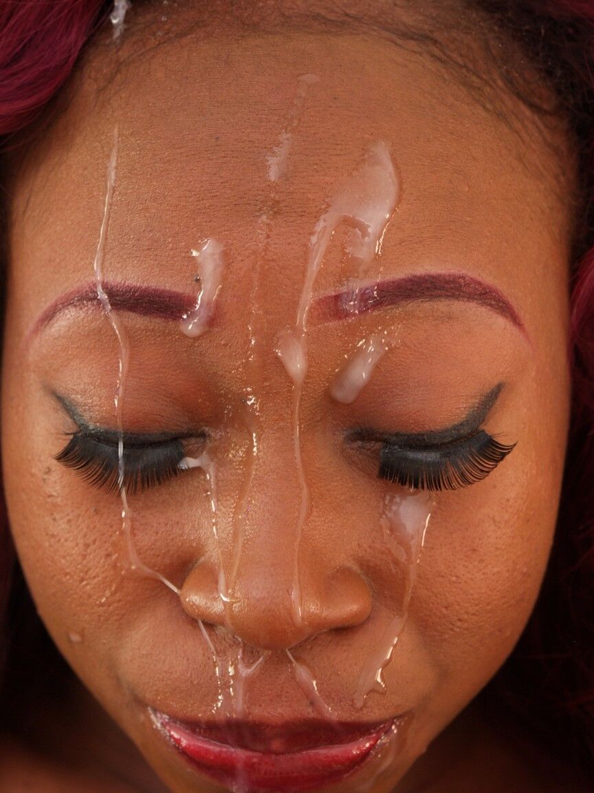 20P Curly haired redheaded ebony gets her face covered with jizz after a blowjob
