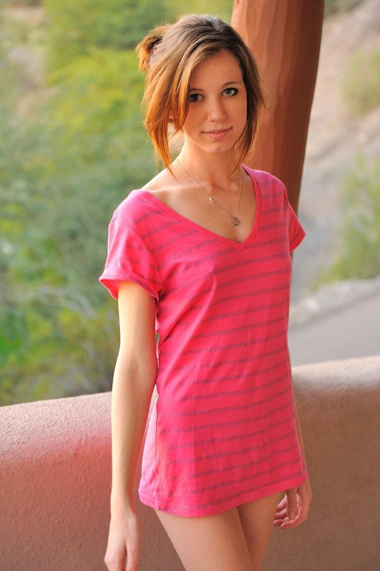 21P Thin brunette Allie teases and poses naked with a bunny toy outdoors